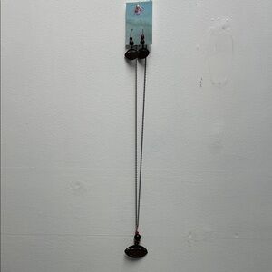 34” long steel necklace w/football pendent w matching earrings.